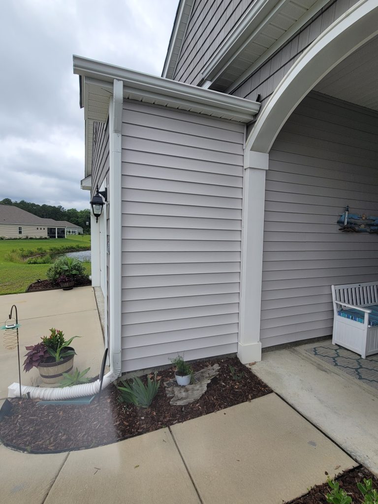 Picture of small planter in front of an east facing wall by front sidewalk. This creates small outdoor microclimates.