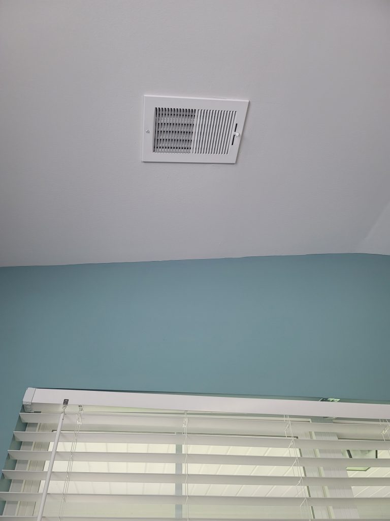 Ceiling  mounted air vent that blows hot or cold air down on planters depending on the season.