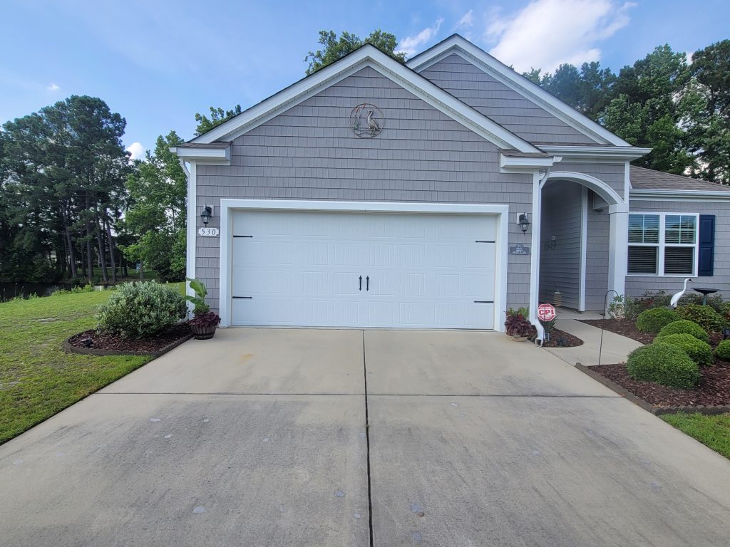 Picture of driveway and planters showing the affects a heat island on microclimates.